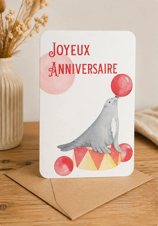 Carte d'anniversaire joyeux anniversaire avec phoque et ballons, design aquarelle sur table en bois