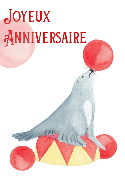 Carte joyeux anniversaire avec phoque équilibrant ballon, design aquarelle festif